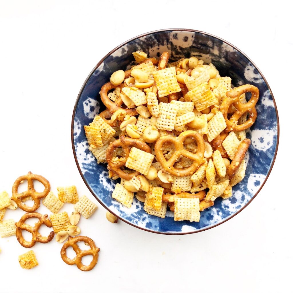 buffalo chex mix in a blue bowl