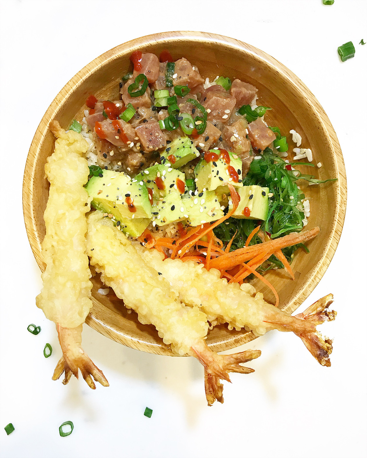 sushi bowl filled with spicy tuna, avocado, shrimp tempura and rice