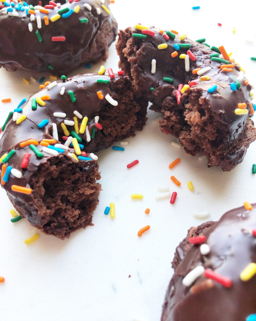 chocolate cake donut in half with sprinkles gluten free donuts
