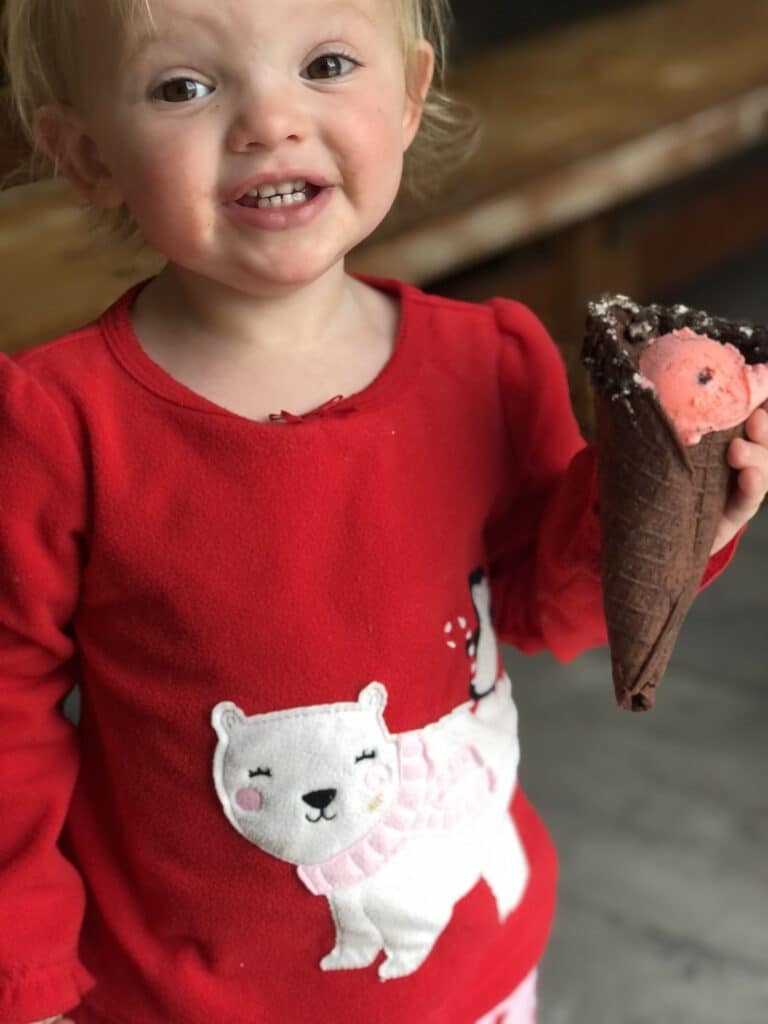 child holding ice cream cone