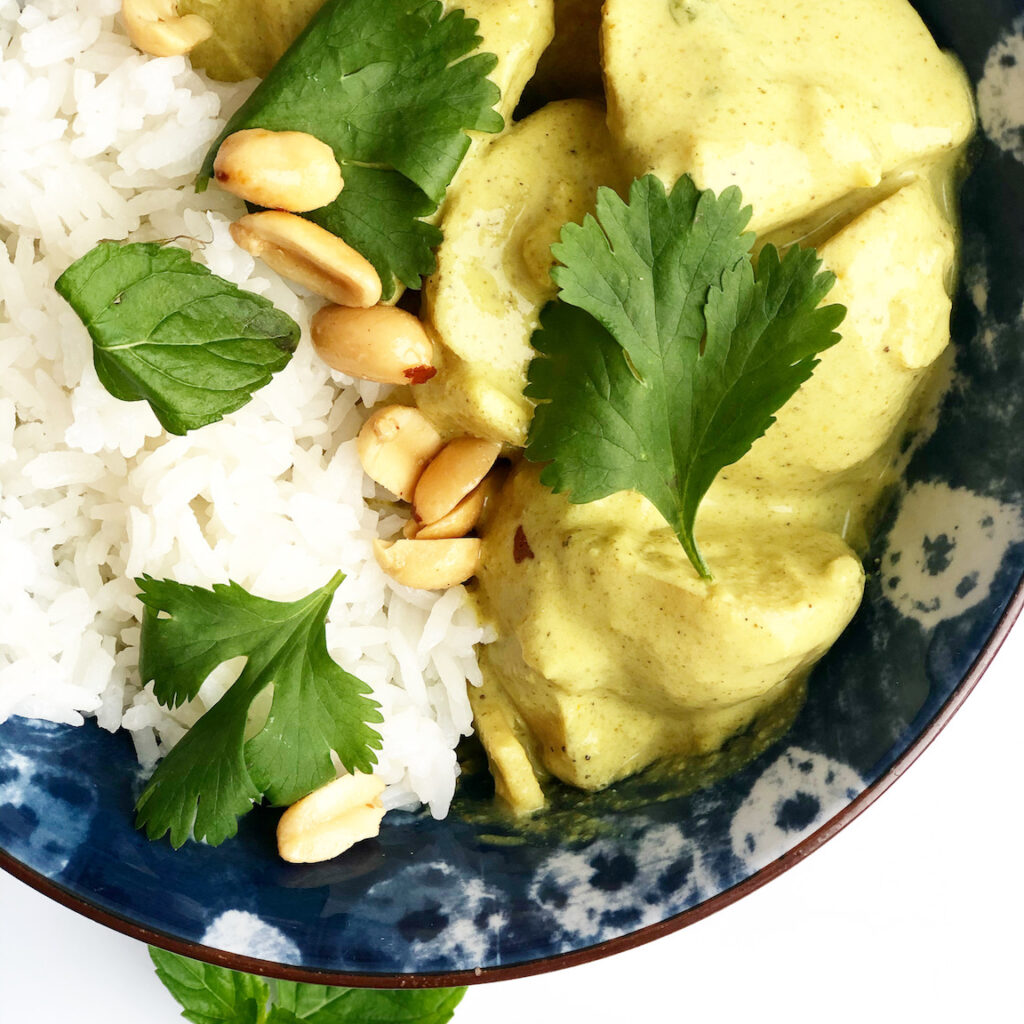 yellow curry in a blue bowl