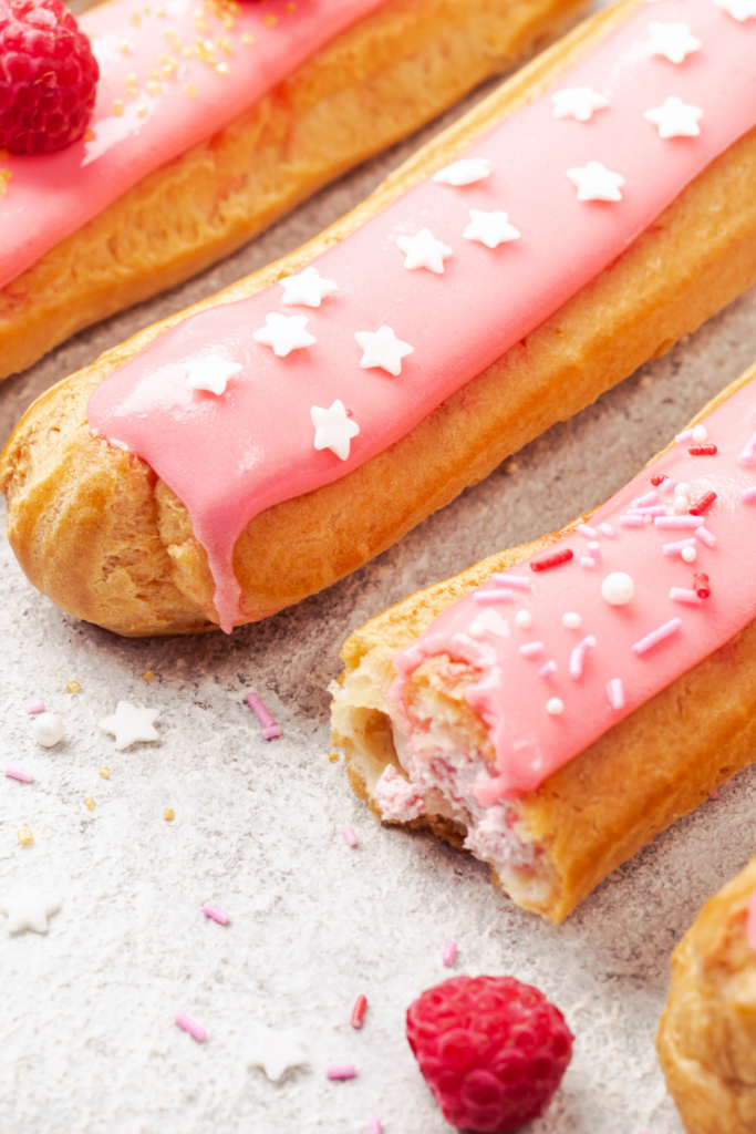 eclairs with pink icing and sprinkles